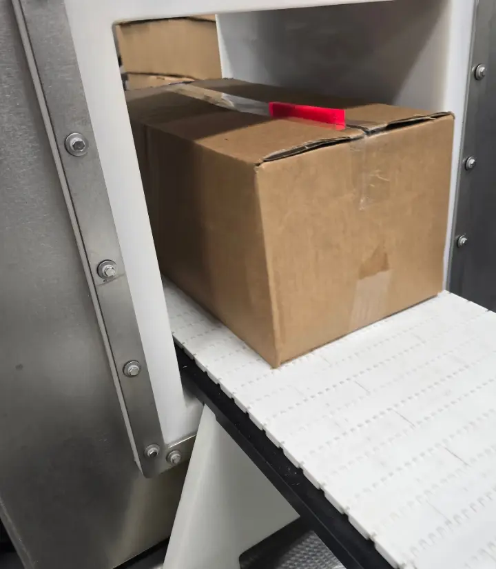 Metal detector with cardboard box and ferrous metal detector test standard